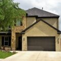 A home with a garage and a driveway.